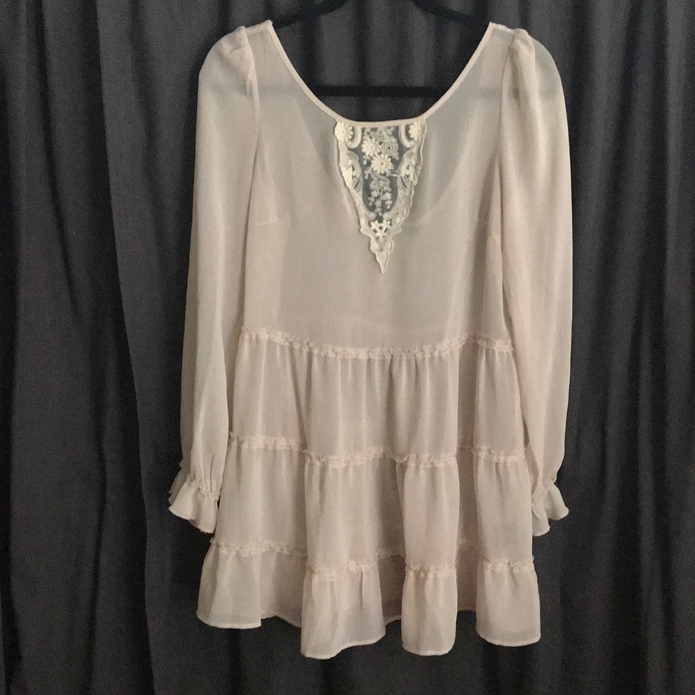 Sheer cream tunic.